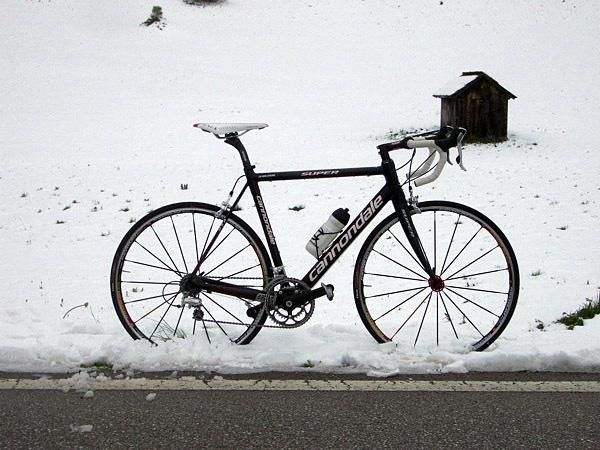 The snow at the top of the Passo Campolongo provides an excellent backdrop for our test bike.