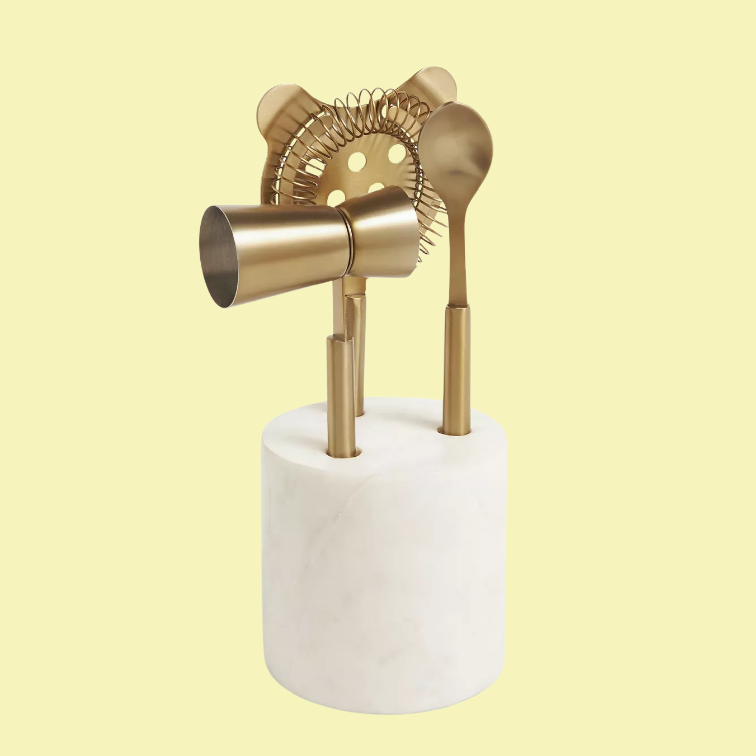 A small bar set in gold in a white stone holder
