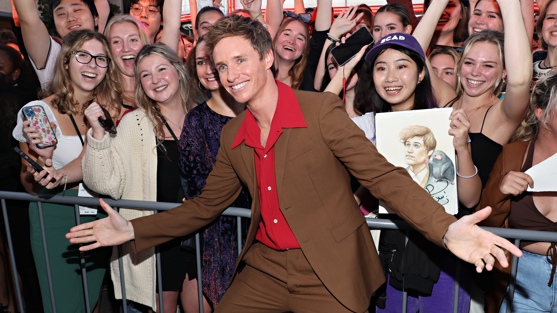 Eddie Redmayne poses with fans during the 25th SCAD Savannah FIlm Festival on October 23.