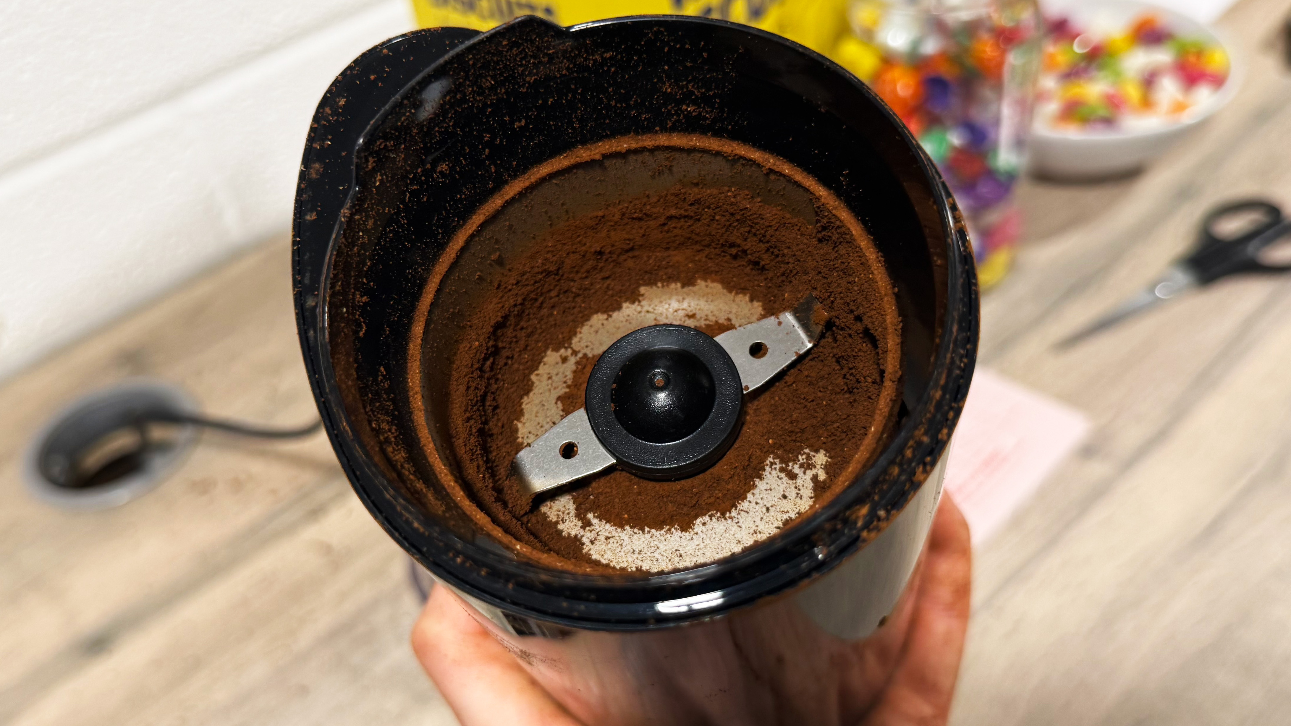 a photo of clumped coffee inside the cuisinart coffee grinder