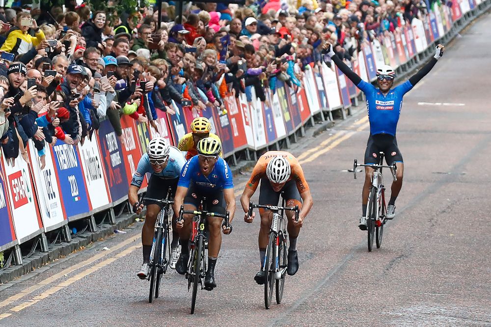 Davide Cimolai celebrates as Italian teammate Matteo Trentin wins the 2018 European championship road race