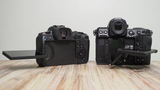 Nikon Z8 vs Canon EOS R5 – the Z8 and R5 sit, side by side, on a wooden surface against a white background