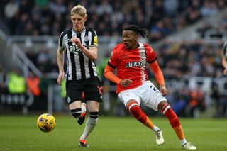 Gabriel Osho of Luton Town is turning away from Anthony Gordon of Newcastle United during the Premier League match between Newcastle United and Luton Town at St. James's Park in Newcastle, on February 3, 2024. (Photo by MI News/NurPhoto via Getty Images)