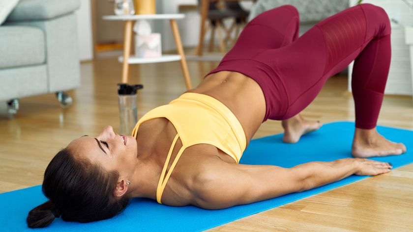 a photo of a woman doing a glute bridge