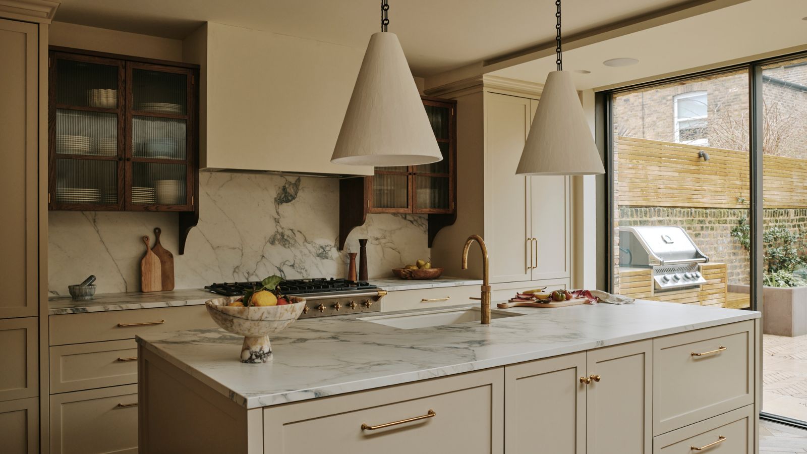 A neutral kitchen with marble countertops