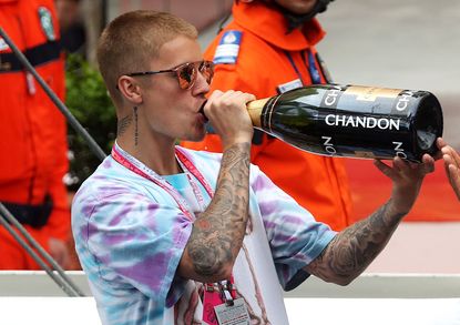 Justin Bieber drinks champagne