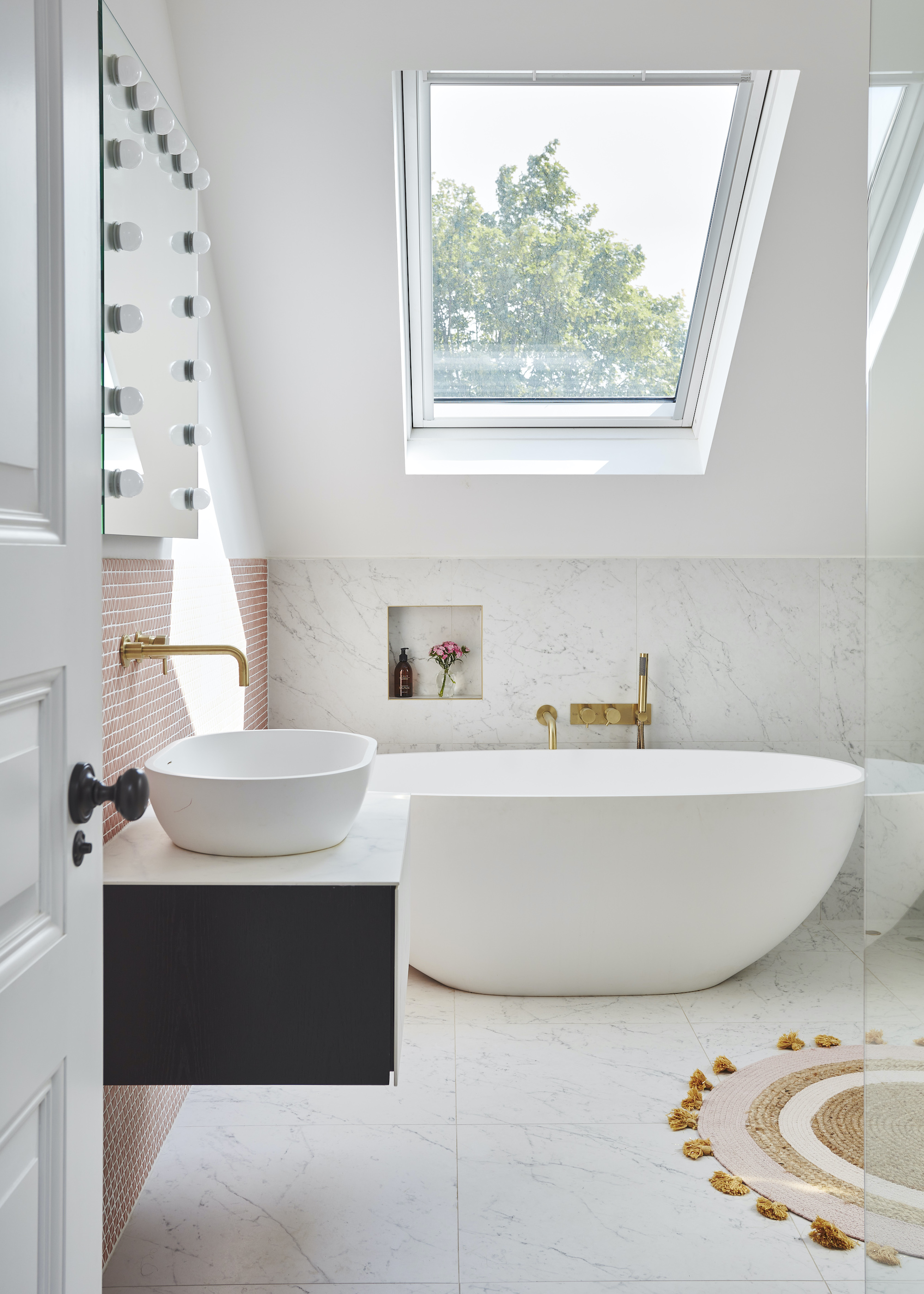 loft bathroom with wall hung basin and freestanding bath