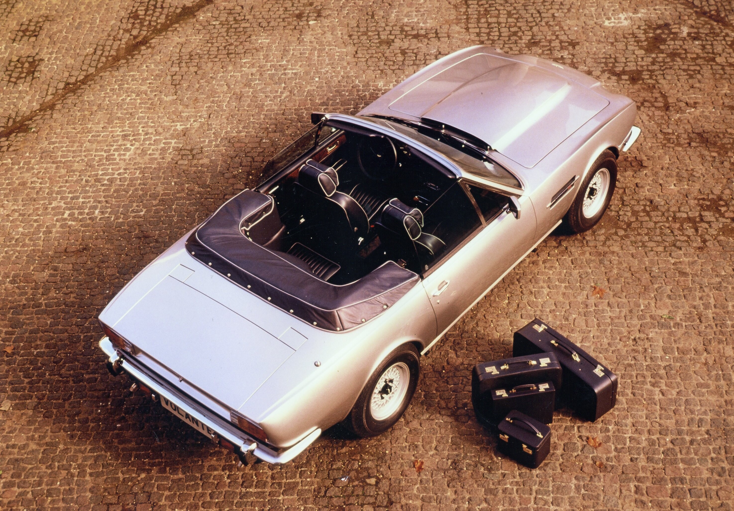 Details of the V8 Vantage Volante, showing the interiors, the engine and the front and rear of the car