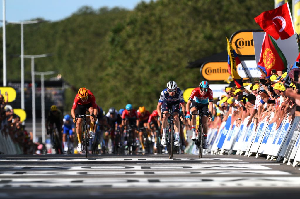 BOURGENBRESSE FRANCE JULY 20 LR Jonas Abrahamsen of Norway and UnoX Pro Cycling Team Kasper Asgreen of Denmark and Team Soudal Quick Step Pascal Eenkhoorn of The Netherlands and Team Lotto Dstny sprint at finish line to win the stage during the stage eighteen of the 110th Tour de France 2023 a 1849km stage from Motiers to BourgenBresse UCIWT on July 20 2023 in BourgenBresse France Photo by David RamosGetty Images