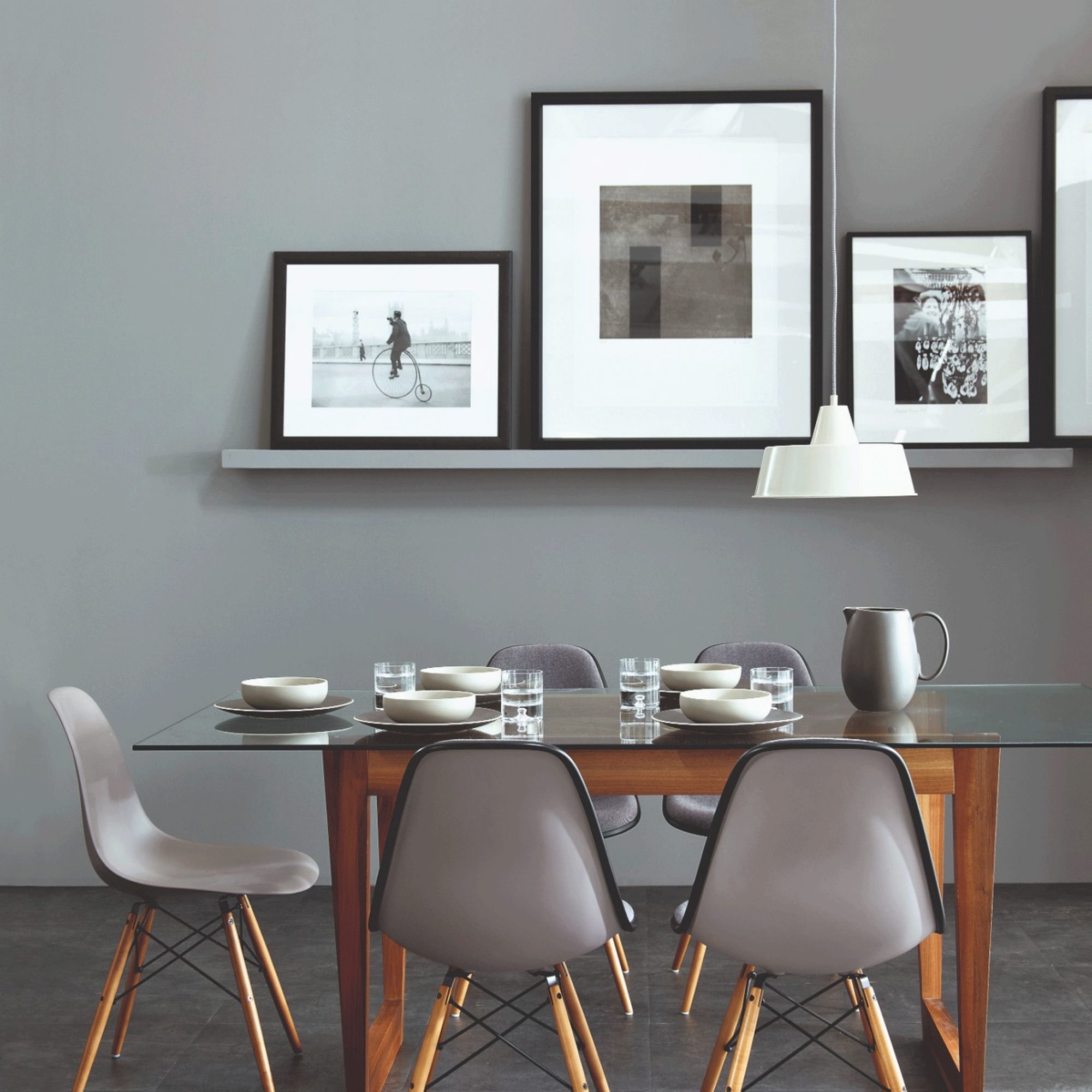 Grey dining room with gallery wall shelf