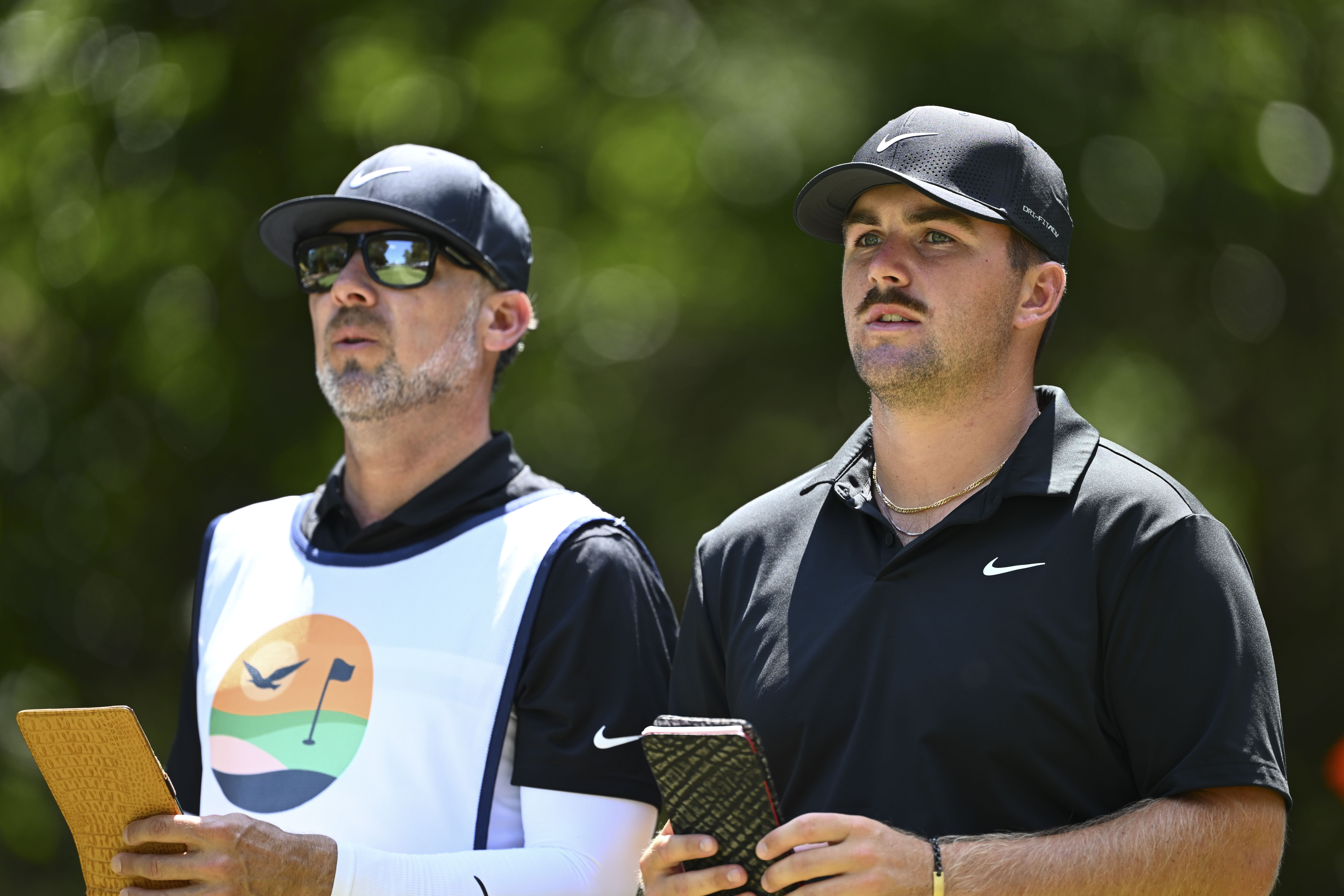 AJ Montecinos and Chris Gotterup speak on the fairway