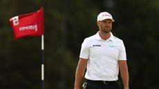 Wyndham Clark walks off the green