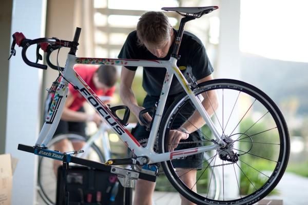 A team mechanic fixes up one of the team's Focus bikes after a training ride.