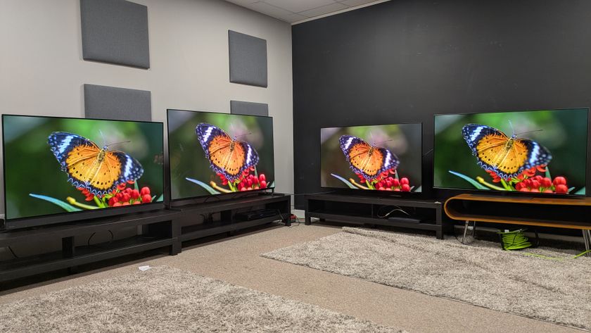 Panasonic Z95B (far left) Sony Bravia 8 II (middle left) Samsung S95F (middle right) LG G5 (far right) with orange butterfly on screen 