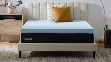 Lucid mattress topper on a bed in a neutral styled bedroom
