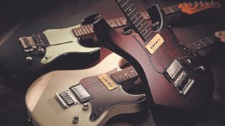 Pile of Yamaha Pacifica guitars