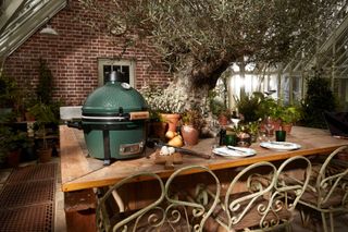 big green egg bbq on outdoor table