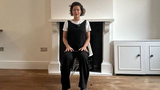 Naomi Annand performs pelvic circles in a chair