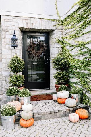 outdoor halloween decor on a porch