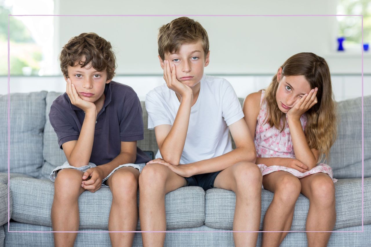 three kids sat looking bored