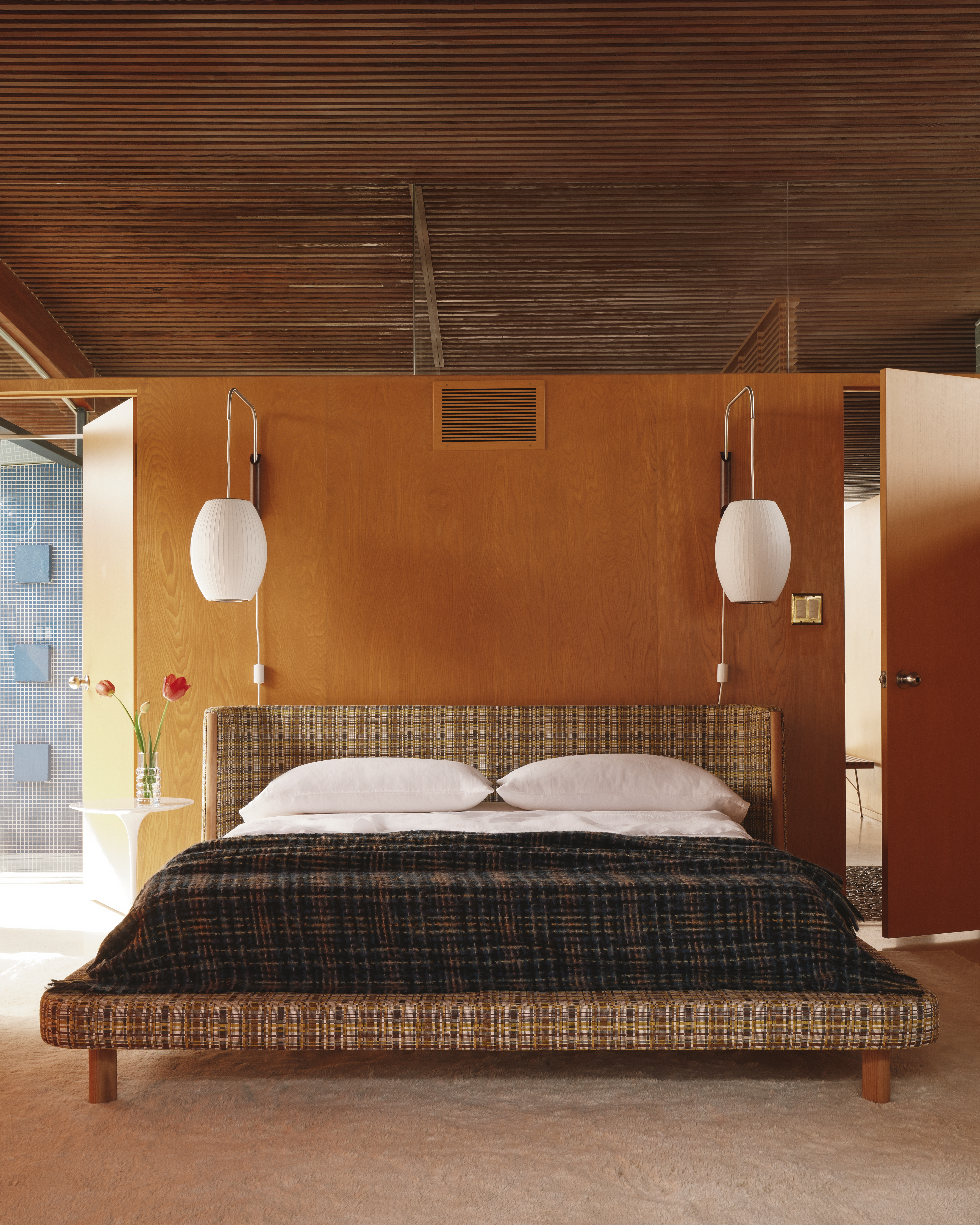 A Californian desert house from the mid 20th-century is furnished with earthy, stripy furnishings and iconic design pieces.