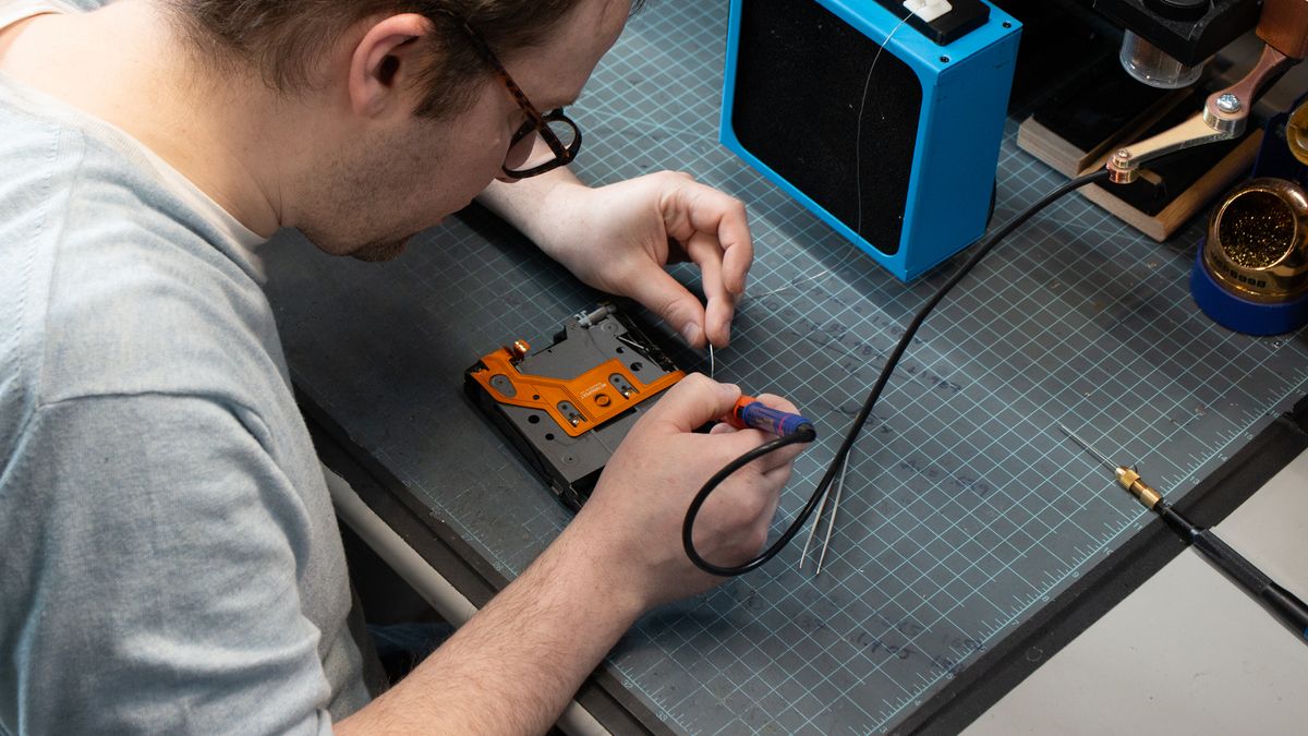 Tear down of the Polaroid SX-70 camera in the Retrospekt workshop during a refurbish