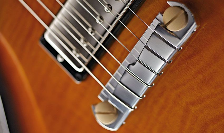 The PRS Stoptail fitted here, with anodised brass posts, is the same part that's used on the Core Line PRS guitars