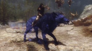Best Skyrim mods — the Dragonborn sits astride a giant, purple, enchanted wolf.
