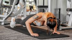 Women doing push up in gym setting