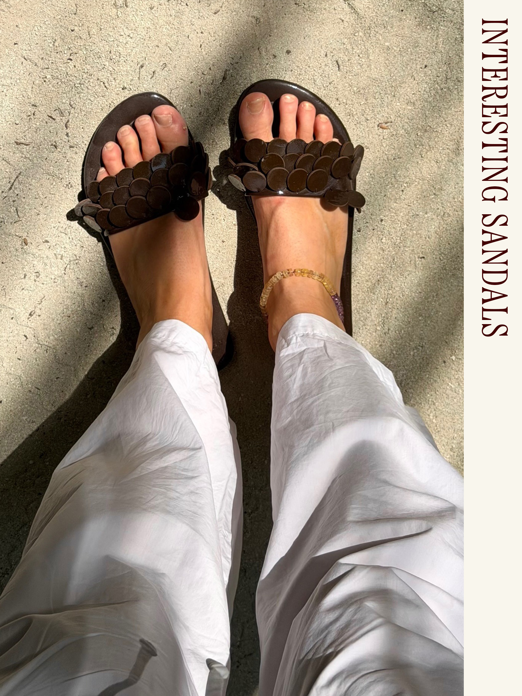 Influencer wearing white poplin pants and embellished sandals