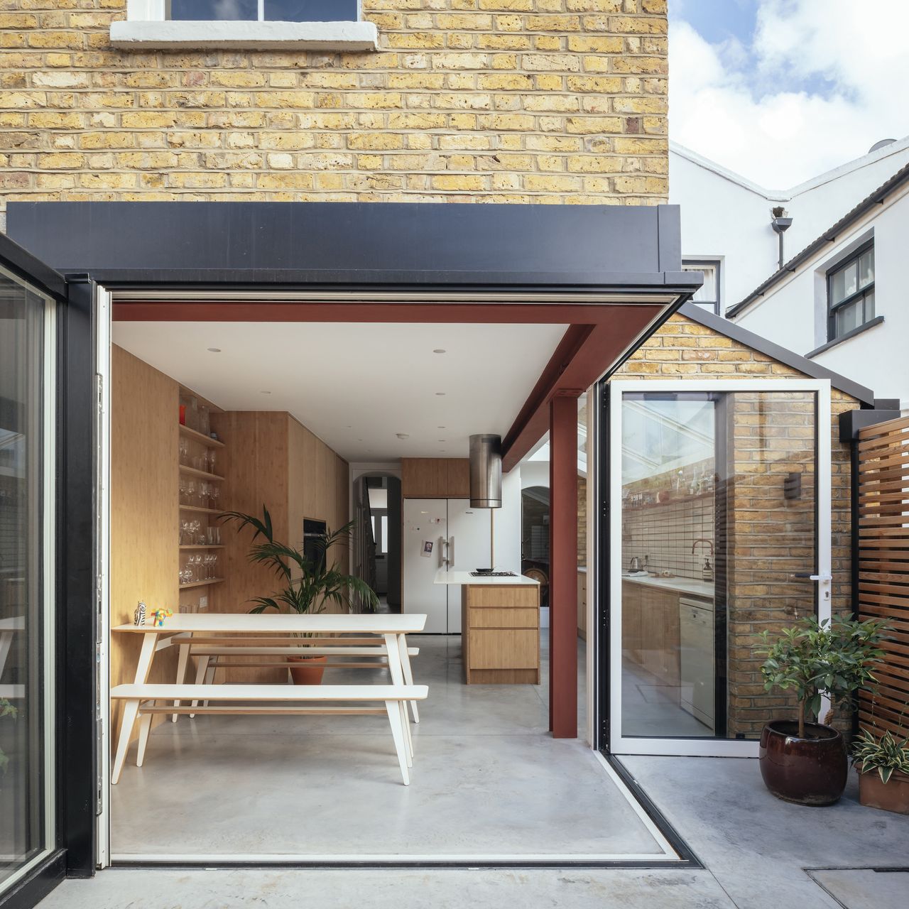 extension with sliding doors and view to interior spaces