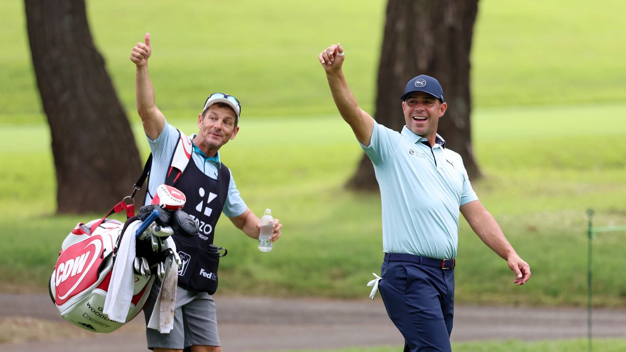 Gary Woodland (right) and his caddie, Brennan Little give a thumbs up to someone out of shot at the 2024 Zozo Championship