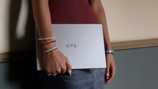 Dell laptop in a woman's hand