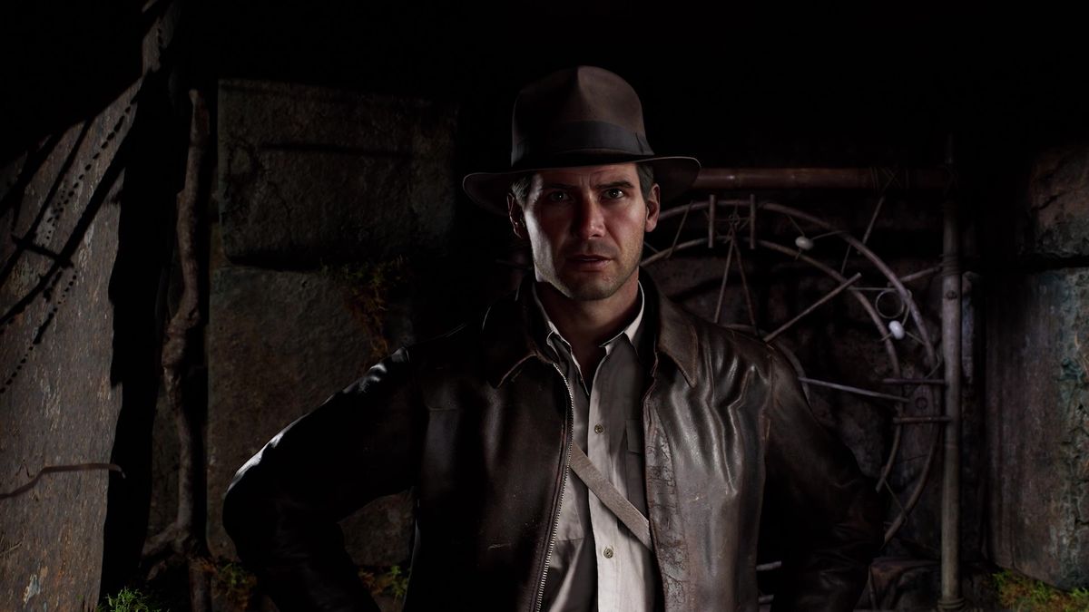 Screenshot of Indiana Jones and the Great Circle deep dive trailer showing Indiana stepping out of the shadows