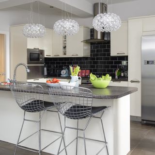 kitchen with statement light and marble worktop