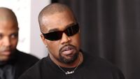 Kanye West wearing sunglasses and wearing a black shirt
