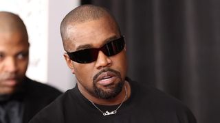 Kanye West wearing sunglasses and wearing a black shirt