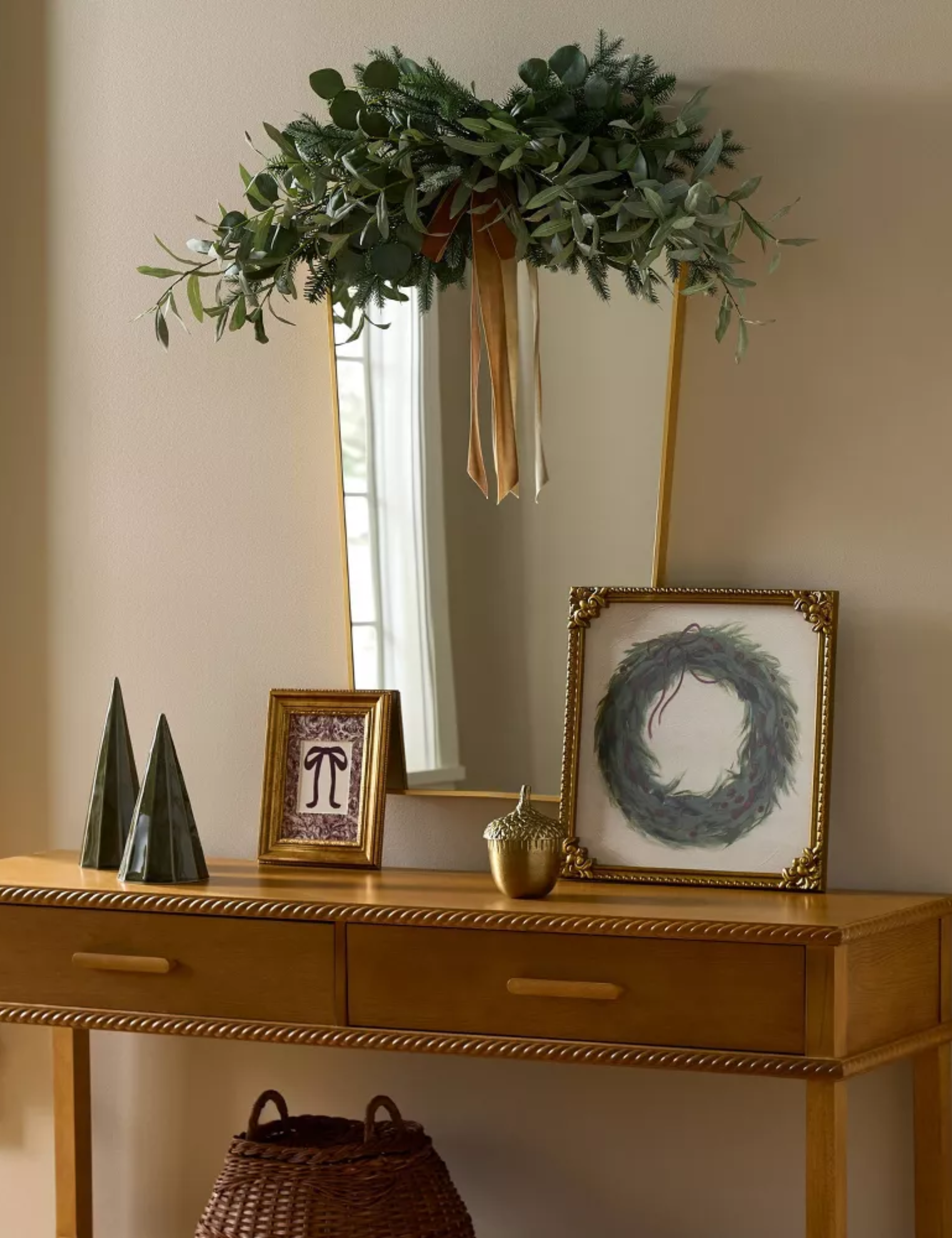 Olive-and-pine Christmas wreath swag styled over a wall mirror