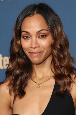 Zoe Saldana is pictured with her hair in glossy waves at the SAG Awards Season Celebration at Chateau Marmont on December 12, 2024 in Los Angeles, California.