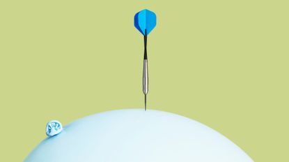 Pin balancing on balloon, representing how to lower cortisol levels