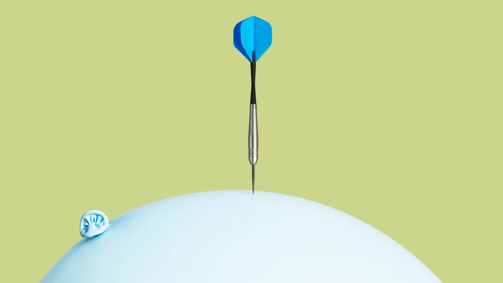 Pin balancing on balloon, representing how to lower cortisol levels