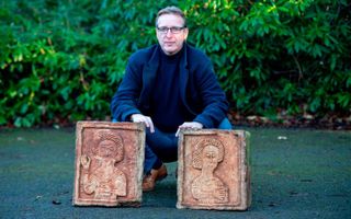 Dutch art detective Arthur Brand poses with two limestone Visigoth reliefs from the seventh century in London on Jan. 20, 2019. 