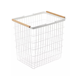 A cutout image of a white metal bin with a wooden rim