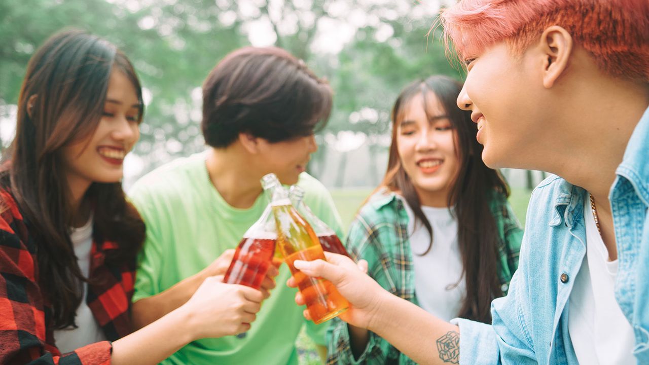 young people drinking something