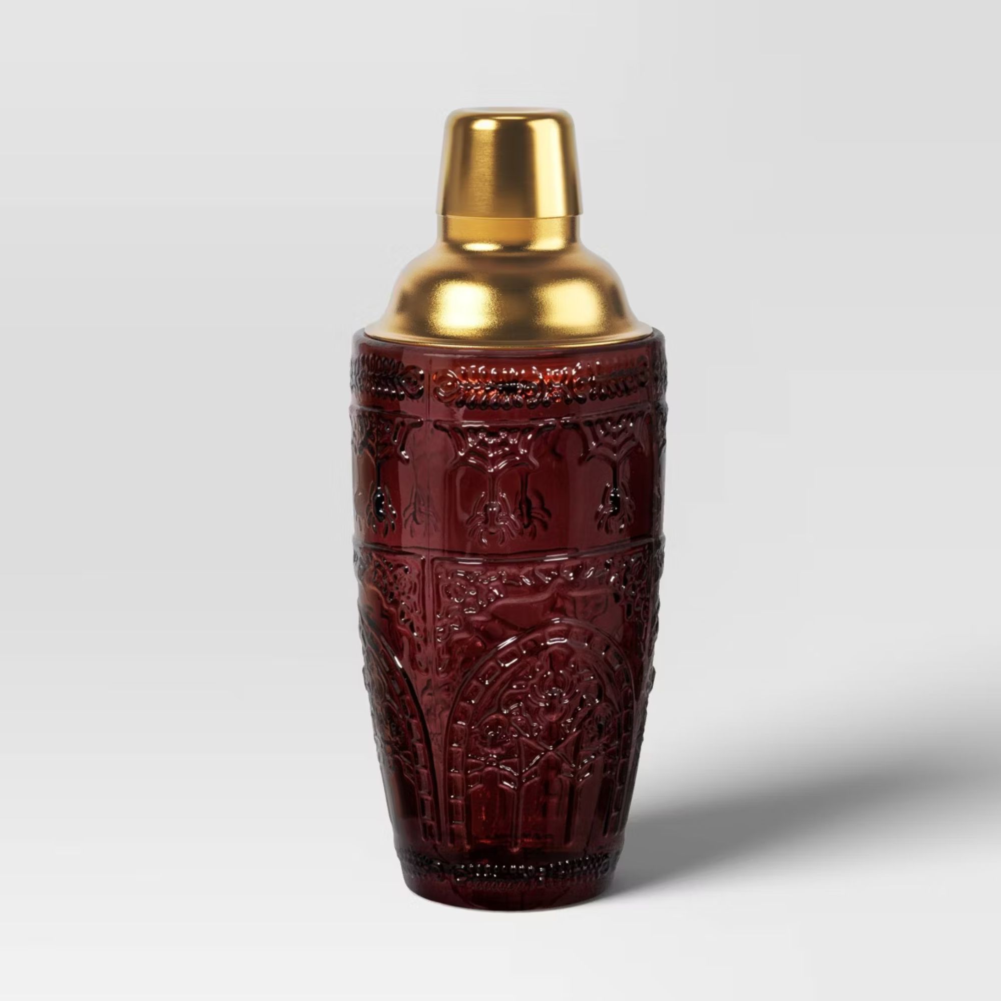 Burgundy glass cocktail shaker with gold lid