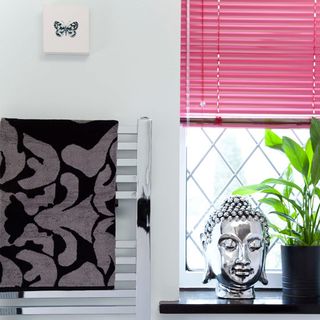 makeover of room with buddha statue and potted plants