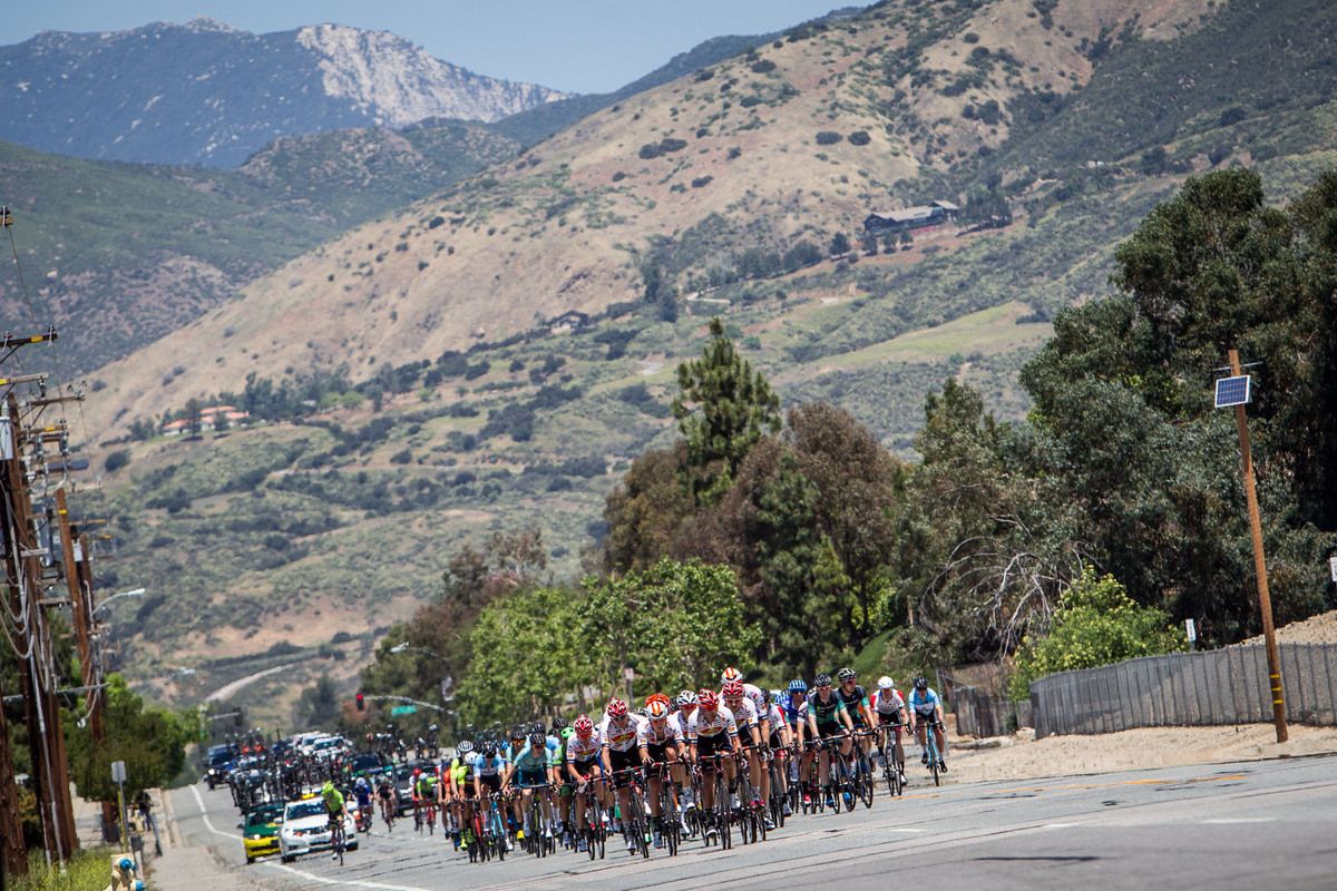 The men roll towards todays long climb