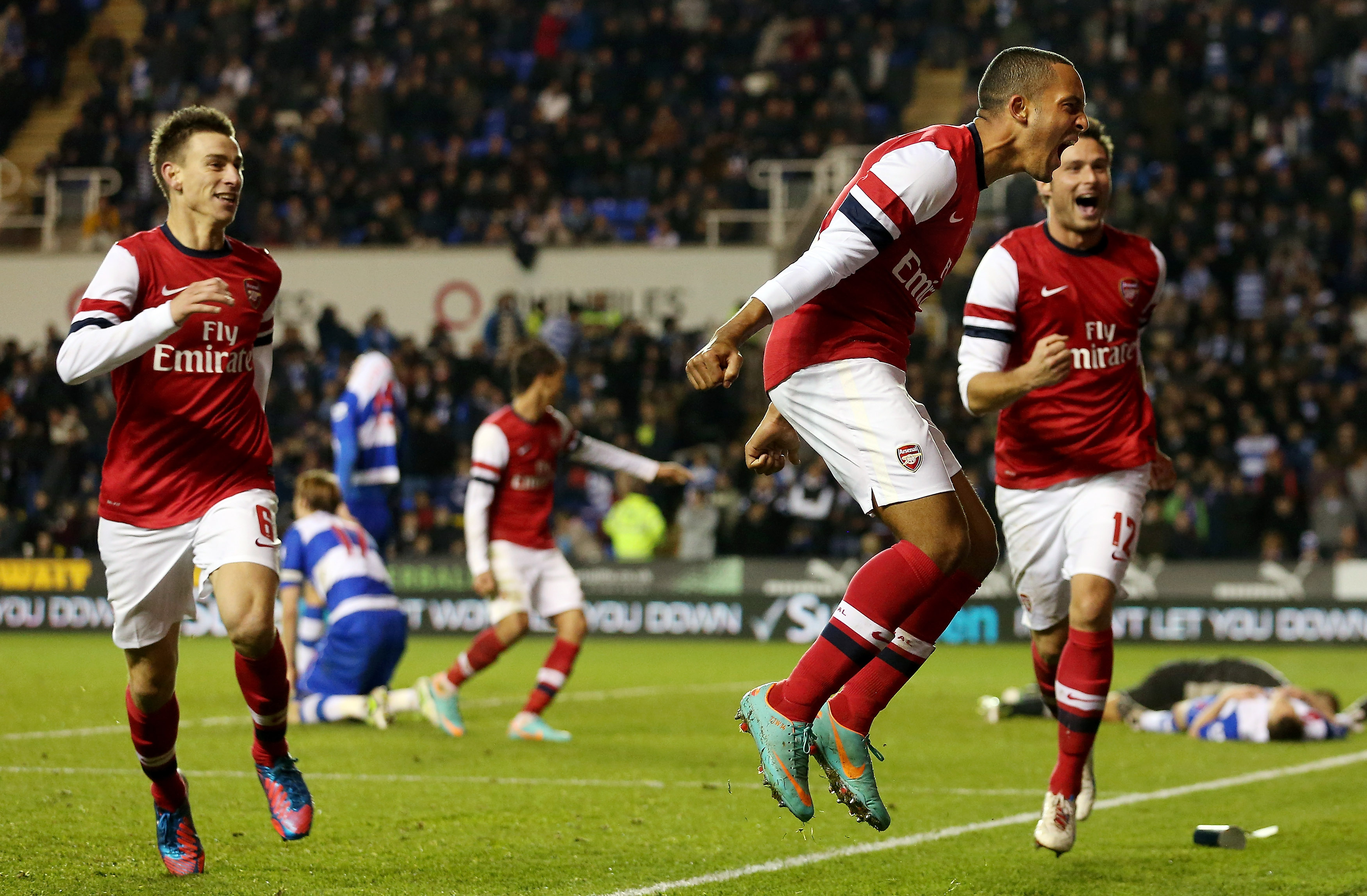 Theo Walcott celebrates after scoring Arsenal's sixth goal against Reading in the League Cup in October 2012.