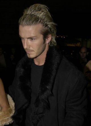 David Beckham wearing a zigzag hairband