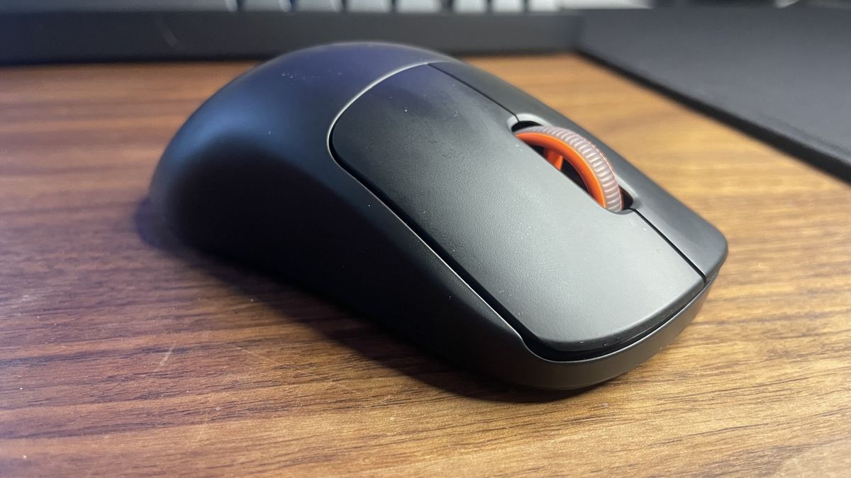 A SteelSeries Sensei Pro gaming mouse.